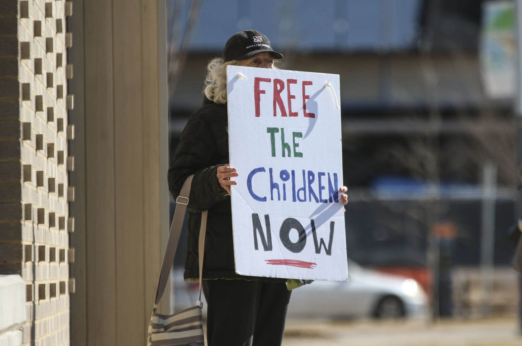 “Free the children NOW” sign